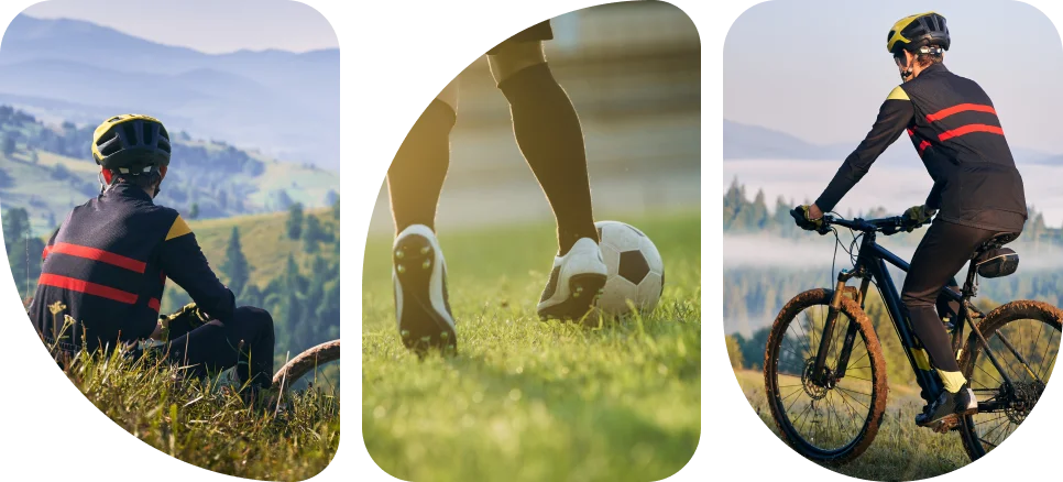 Un cycliste portant un casque et un maillot rayé est assis dans une haute herbe, surplombant un paysage vallonné serein avec des couches de chaînes de montagnes lointaines sous un ciel dégagé.